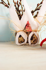 Decorative Easter composition. Easter eggs and napkins in the form of an Easter bunny. Easter background with place for text.