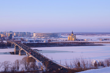 NIZHNY NOVGOROD, Russia - January 06, 2019.  Sports arena, Kanavinsky bridge and Alexander Nevsky Cathedral in Nizhny Novgorod. Winter twilight.