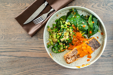 salmon steak with salad