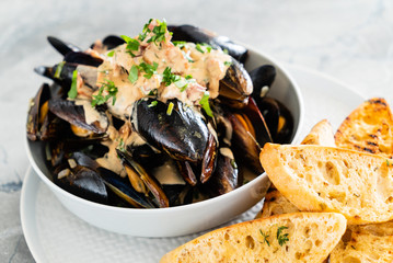 Mussels with herbs in a bowl