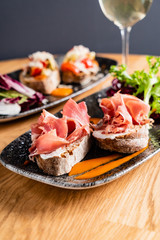 Sandwich with prosciutto, cheese and lettuce
