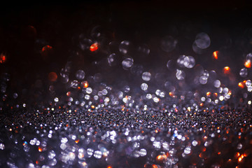 Dark glitter magic background. Defocused light and free focused place for your design.