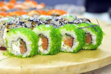 Sushi set: sushi roll with salmon and sushi roll with smoked eel, selective focus.