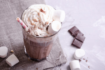 hot chocolate with cream, powdered sugar and berries