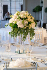 flower arrangement on a table for a wedding dinner
