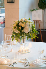 flower arrangement on a table for a wedding dinner