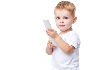 Small blond boy in white clothes holding  TV remote control on white isolated background