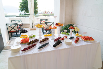 Banquet table full of fruits and berries