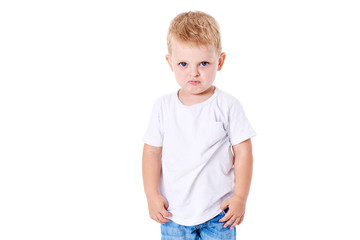 A cute little boy in a white T-shirt. The concept of promotional goods, inscriptions and drawings on clothes. Isolated on white background