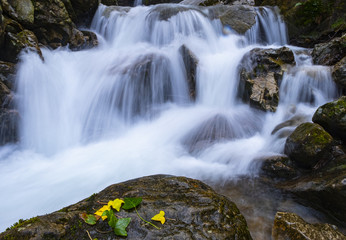 Naklejka na ściany i meble Waterfall in autumn, Aitzondo waterfall in the natural park of Aiako Harriak, Basque Country