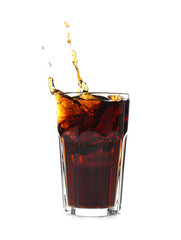 Splash of cola in glass on white background