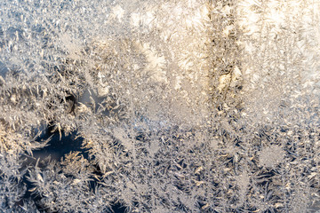 Closeup Photo of Details in Hoarfrost on Window on a Sunny Winter Day - Abstract Background