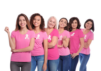 Group of women with silk ribbons on white background. Breast cancer awareness concept