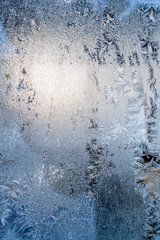 Closeup Photo of Details in Hoarfrost on Window on a Sunny Winter Day - Abstract Background
