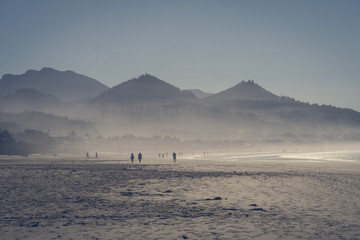 The ocean mist enters at sunset in Cannon Beach, Oregon, USA.