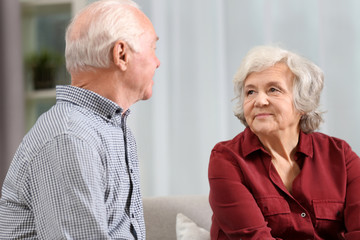 Portrait of elderly spouses on blurred background