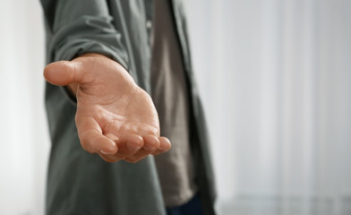 Man giving hand to somebody, closeup. Help and support concept - obrazy, fototapety, plakaty
