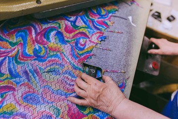 Hands making shoes. Making shoes manual. Shoemaker sitting in workshop making shoes. Footwear manufacture. Shoes factory.