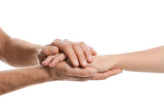 Man comforting woman on white background, closeup of hands. Help and support concept