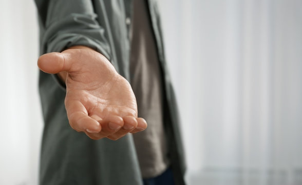 Man giving hand to somebody, closeup. Help and support concept