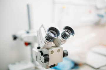 Fototapeta na wymiar Professional medical microscope in a research center.