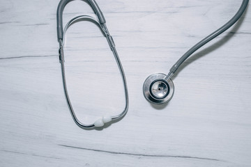  Medical stethoscope, phonendoscope on a wooden table. concept of medical care