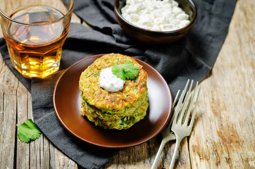 Zucchini ricotta cilantro fritters with fresh cilantro leaves