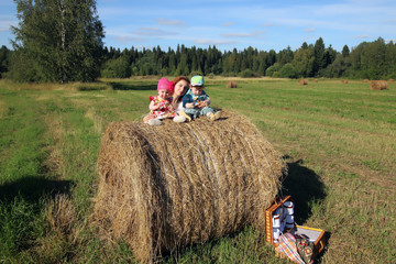 Obraz premium mother with twins in field