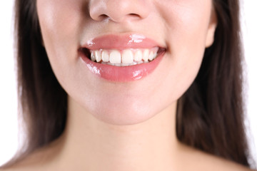 Young smiling woman with healthy teeth, closeup