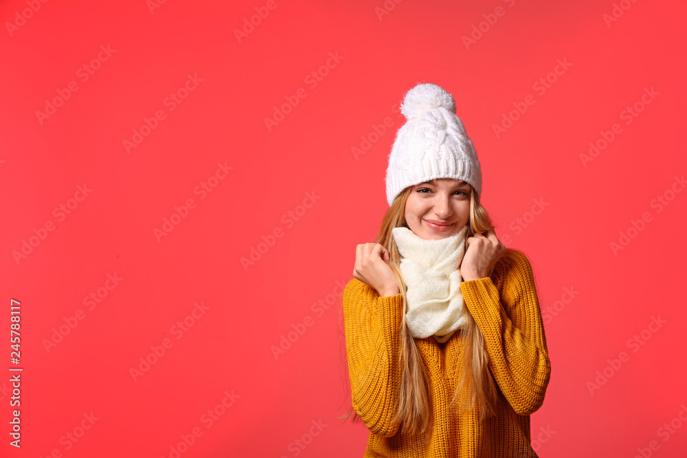 Sticker Portrait of emotional young woman in stylish hat, sweater and scarf on color background, space for text. Winter atmosphere