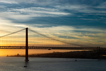 Fototapeta na wymiar Bridge in Lisbon during sunset, Portugal skyline and cityscape on the Tagus River