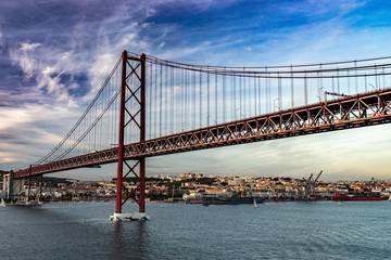 Bridge in Lisbon during sunset, Portugal skyline and cityscape on the Tagus River