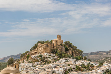Fototapeta na wymiar Beautiful cityscape with castle on hill in Montefrio in Spain