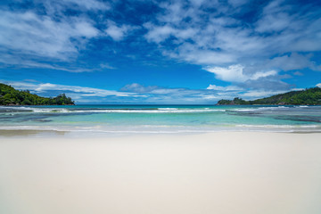 Beautiful beach. View of nice tropical beach with palms around. Holiday and vacation concept. Tropical beach.