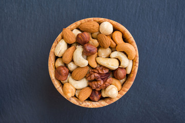 Various nuts on stone background. Concept healthy snack.