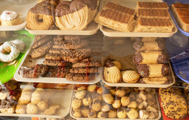 Shelves with cookies on the window. Confectionery. Quito, Ecuador