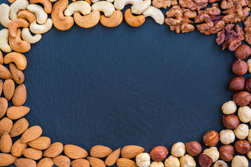 Various nuts as concept healthy snack. Food background frame.