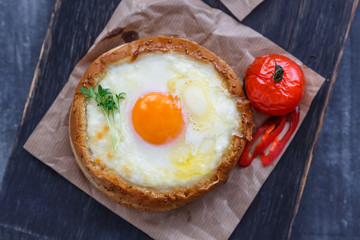 Breakfast with baked cheese and egg yolk filled buns