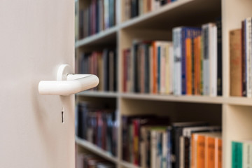 Open door leads to the library, retro vintage design