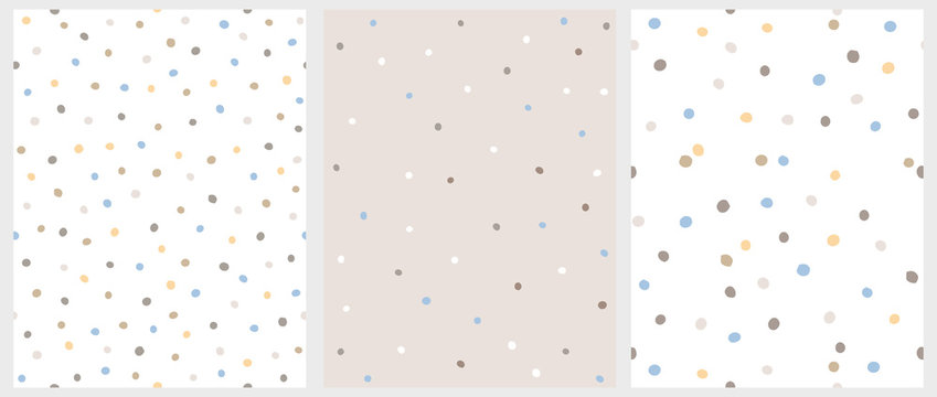 Fototapeta Set of 3 Hand Drawn Irregular Dots Patterns. Blue, Brown and Beige Dots on a White Background. BLue, White and Brown Dots on a Beige Background. Infantile Style Abstract Art. Cute Repeatable Design.