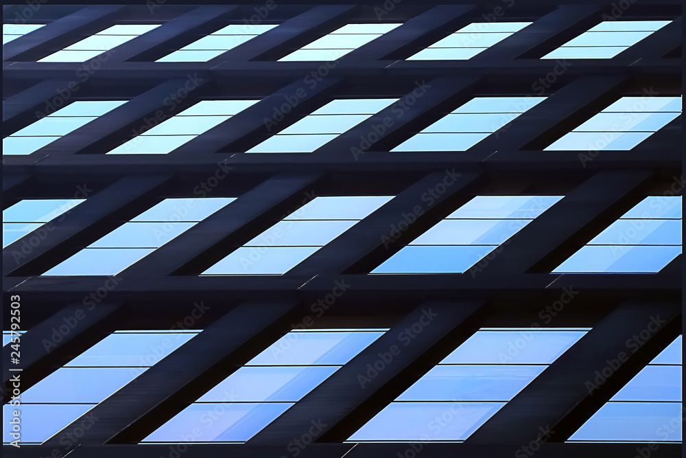 Wall mural geometric architectural background of blue. skyscraper glass windows.