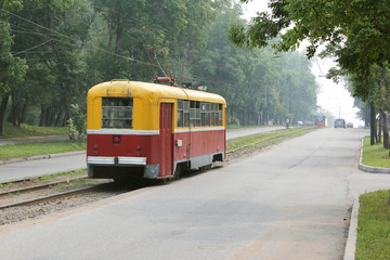 Tram rides on a lonely street