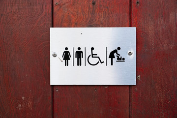 Disabled and baby change male female toilet sign