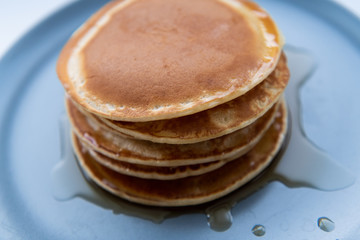 Sweet homemade stack of pancakes with maple syrup for breakfast