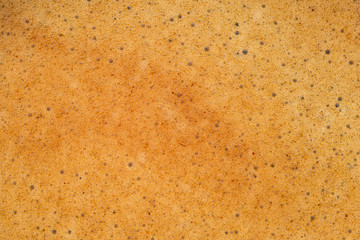 Black coffee crema foam texture.