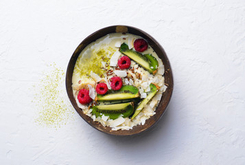 Smoothie Bowl Topped with Raspberry, Kiwi, Chia, Flaxseed and Coconut