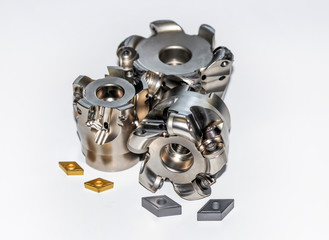Two undamaged and one damaged indexable milling cutter for CNC milling machine with two types of...