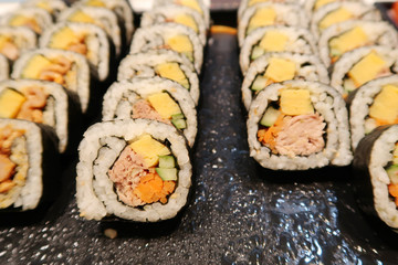 Sushi roll japanese food in restaurant. ,Sushi roll set with salmon, vegetables, eggs, cucumbers, carrots.