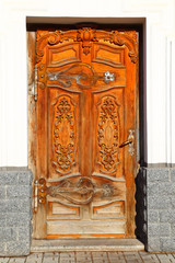 Ancient wooden door with carved patterns