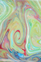 Fluid art in green color. Abstract colorful background. Multicolored pattern on liquid. Colored paint stains in liquid
